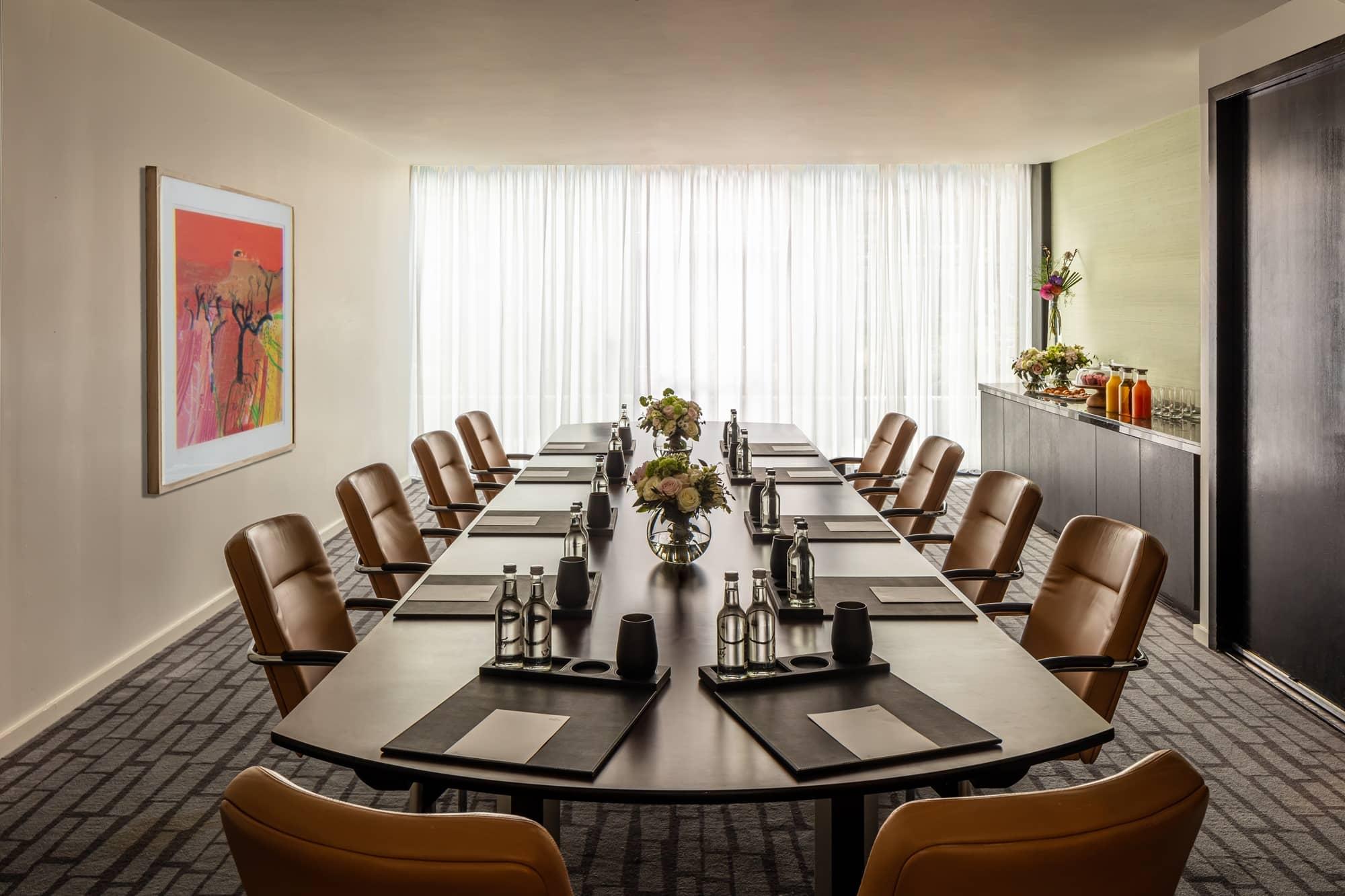Boardroom-style meeting room set for a corporate offsite